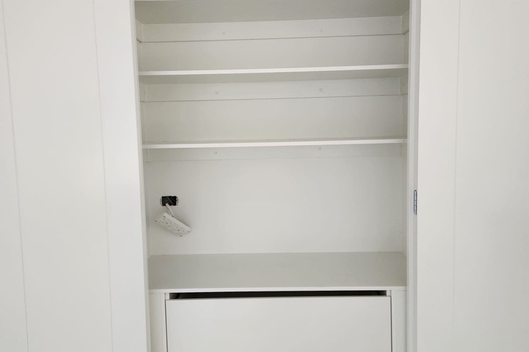 Installer fitting a built-in wardrobe